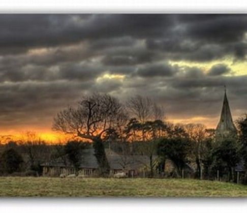 moody picture of the countryside and church at Broughton